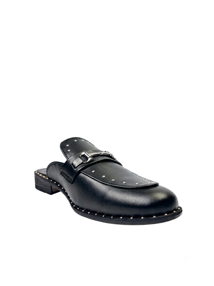 Side profile of RENARD NOIR black open back leather mules showing studded sole rim⁠  