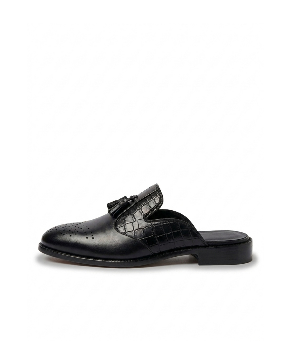 ⁠Side profile of RENARD NOIR black leather tassel mules showing croc texture and brogue toe
